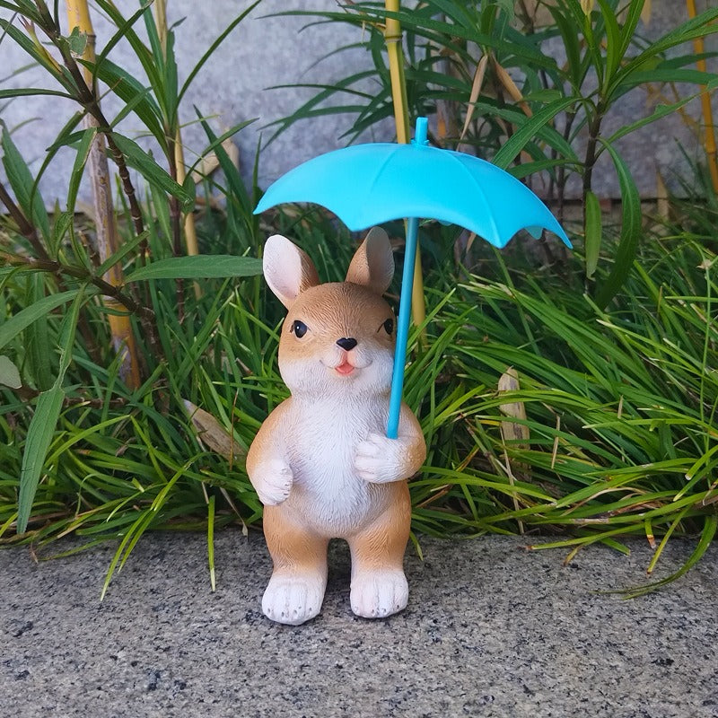 Figura de conejo con paraguas para jardín