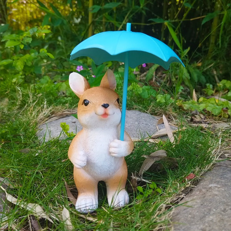 Figura de conejo con paraguas para jardín