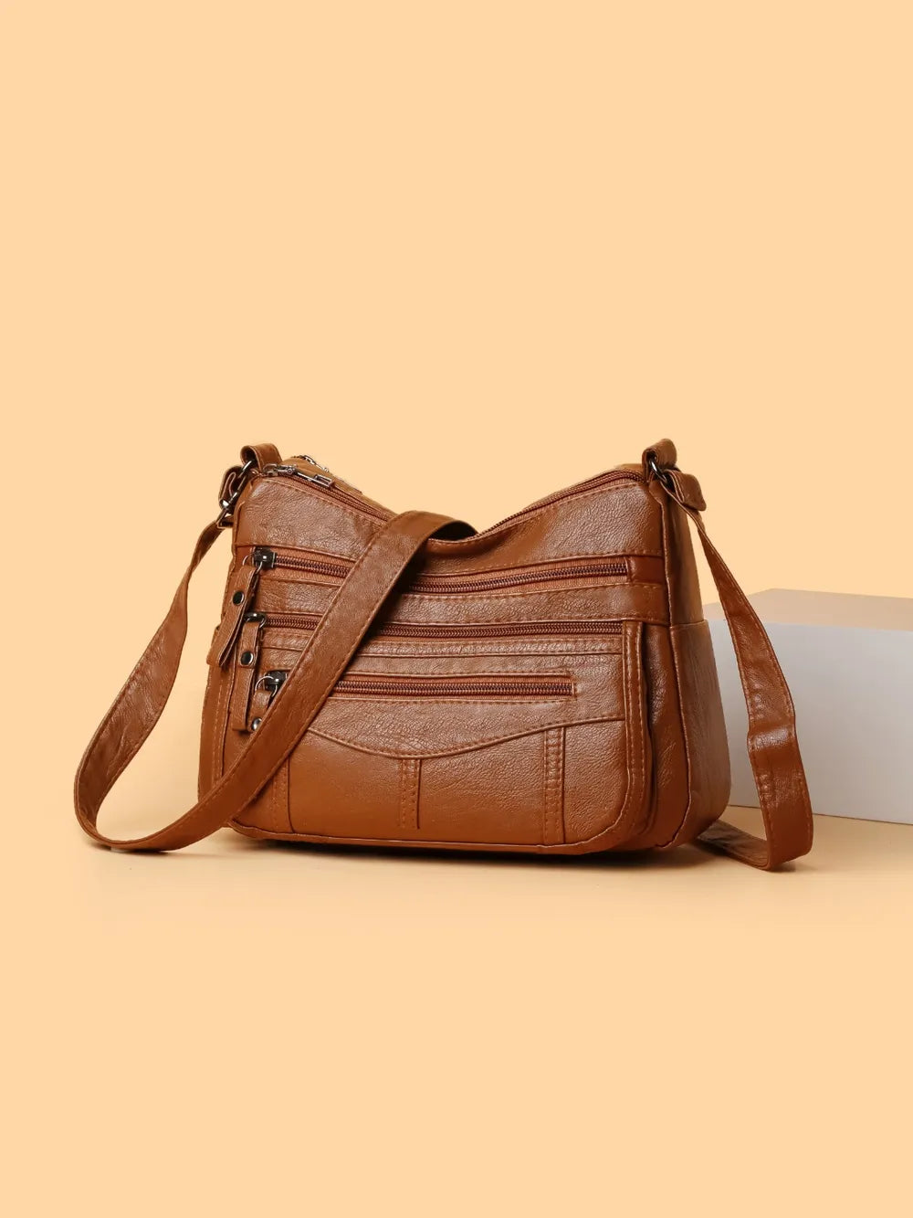 Bolso bandolera con varios compartimentos de 26 × 18 × 9 cm